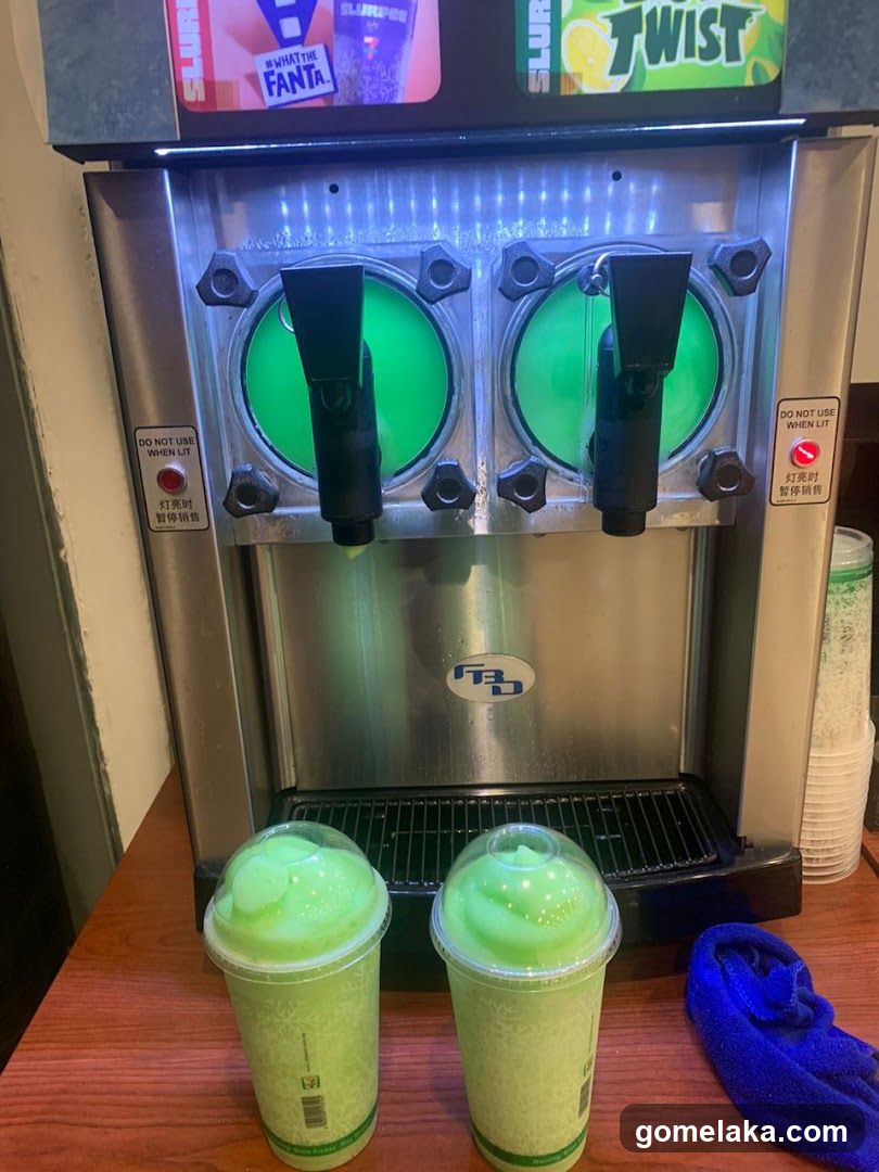 Slurpee Machine with Green Drinks