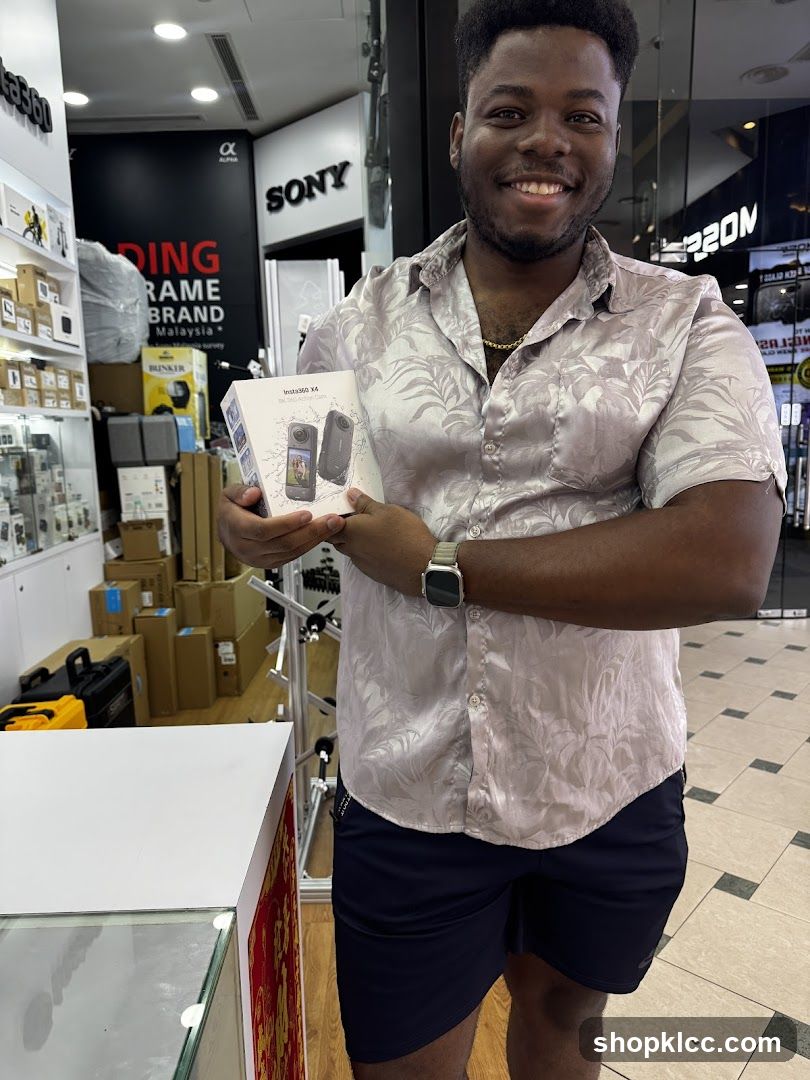 Man holding a camera box