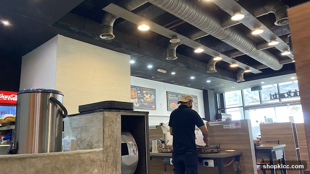Restaurant Interior with Staff Cooking