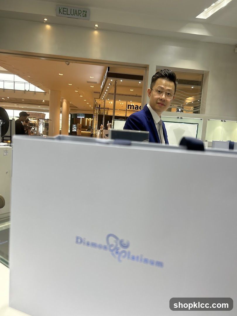 Man in a suit behind a counter