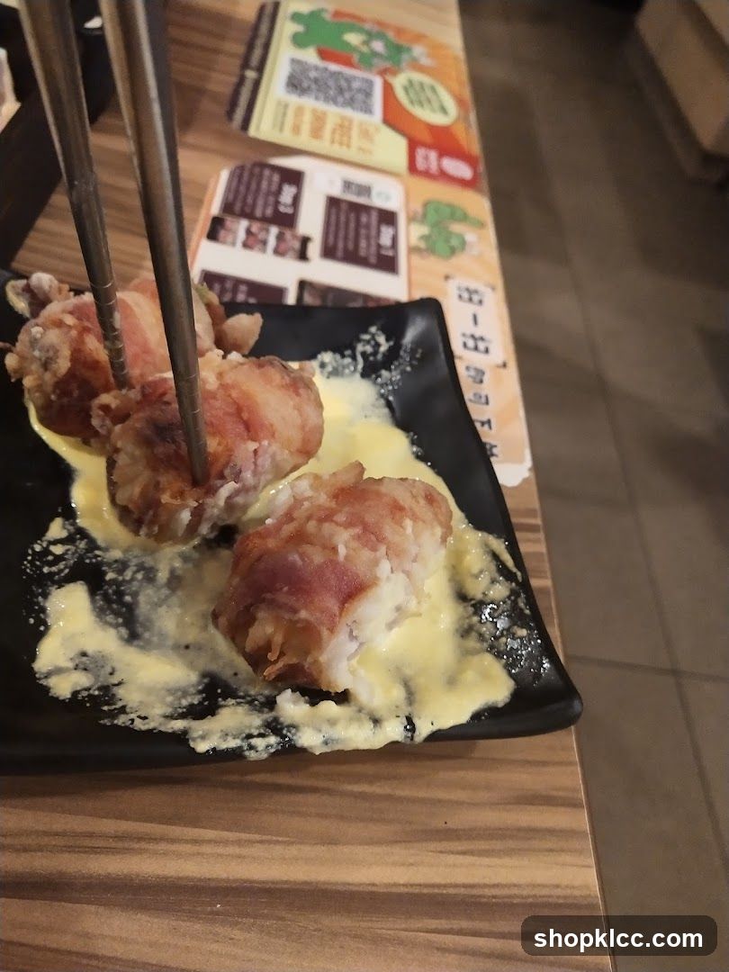 Bacon-wrapped food with sauce