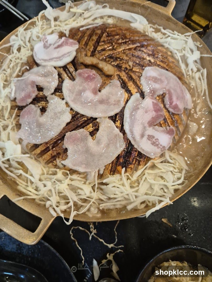 Grill Pan with Sliced Pork and Cabbage