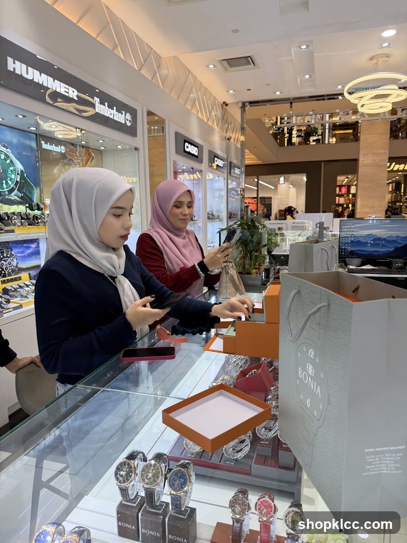 Customers browsing watches in a store