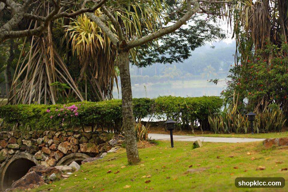 Lush Garden Landscape with Lake View