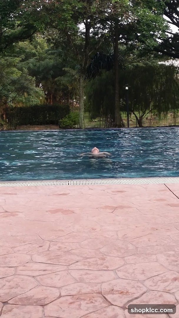 Person swimming in a pool