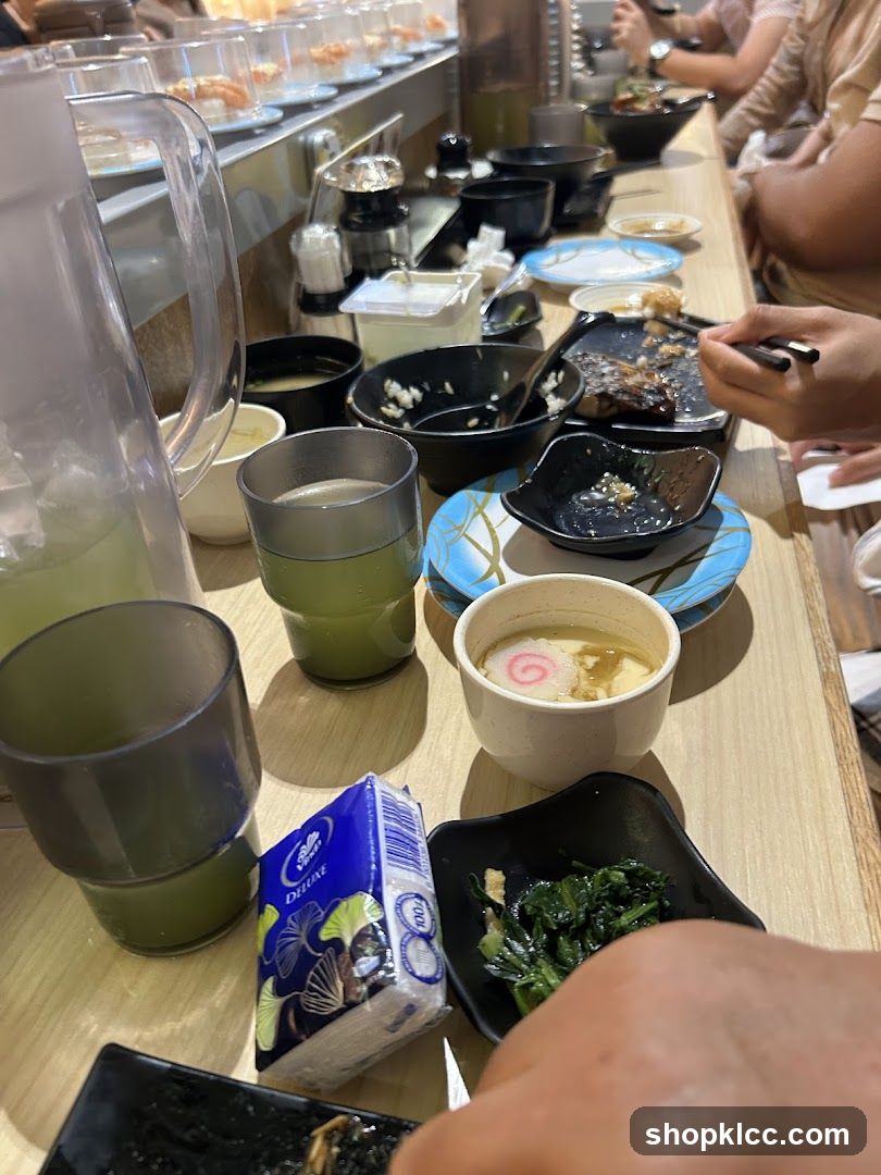 Diners at a Sushi Conveyor Belt Restaurant