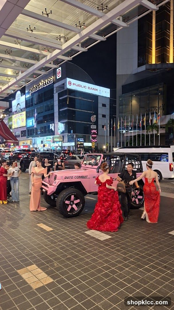 Pink Jeep with Women in Dresses