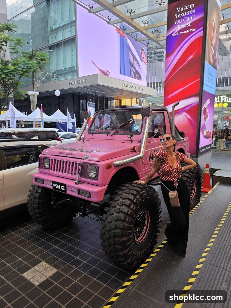 Woman Posing with Pink Off-Road Vehicle