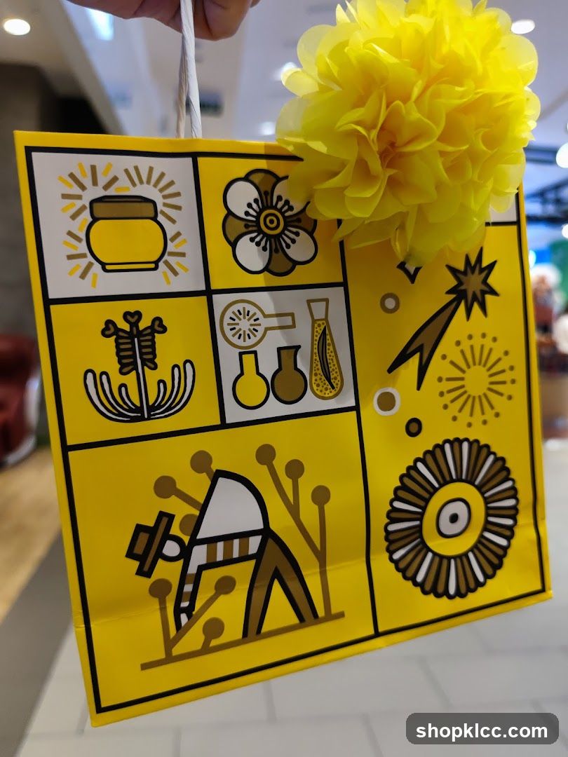 Yellow gift bag with graphic designs