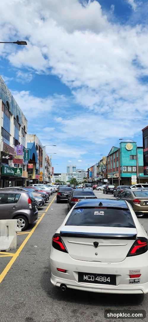 Street view with parked cars and buildings