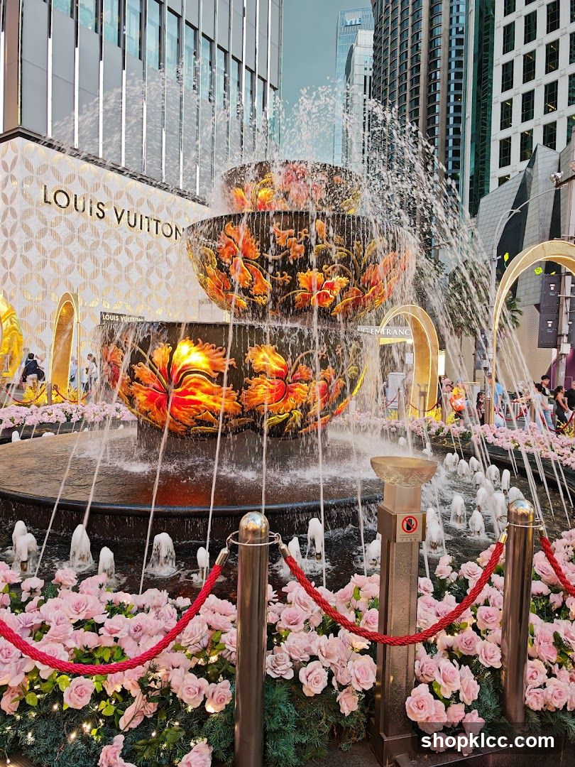 Fountain with Louis Vuitton Store Facade