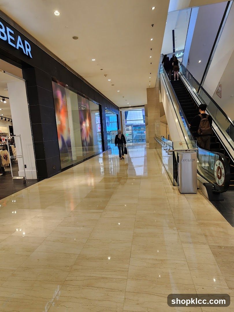 Mall Interior with Escalator and Storefront