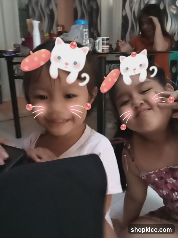 Two young girls with cat filters