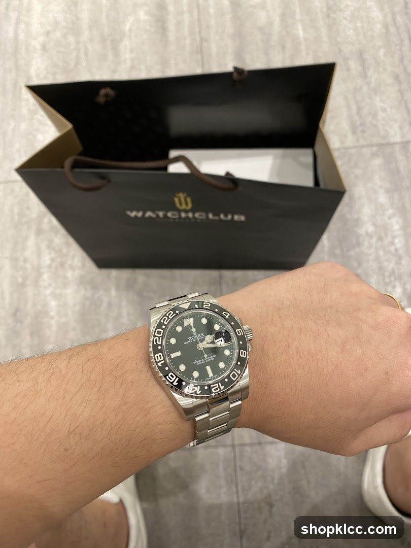 Watch on wrist with shopping bag in background