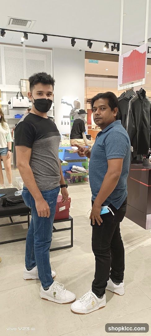 Two men in a clothing store interior
