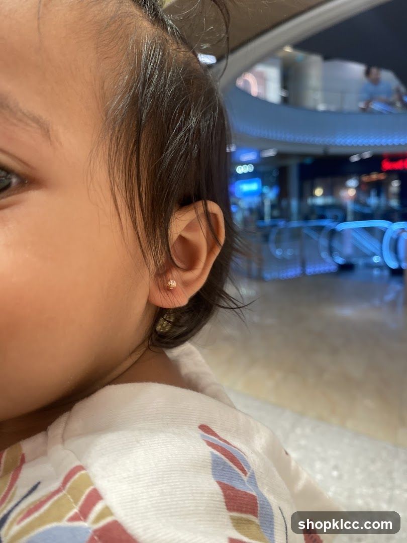 Close-up of a child's ear with an earring