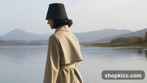 Woman in Hat by Lake
