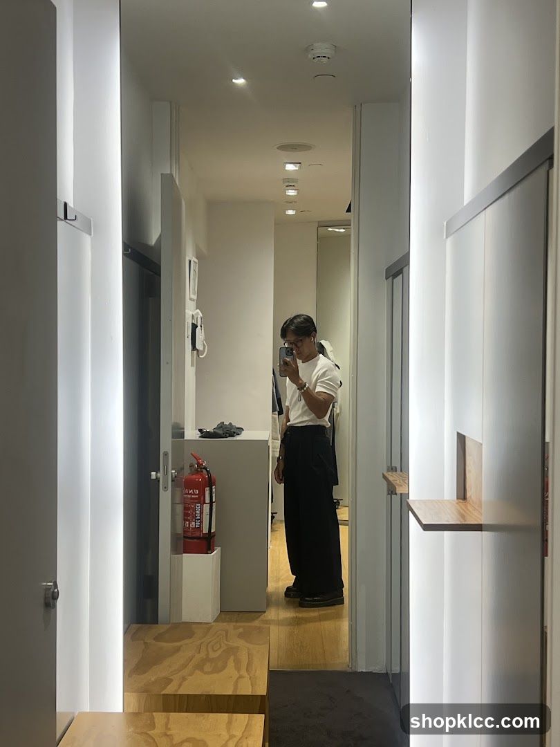 Interior hallway with person taking mirror selfie