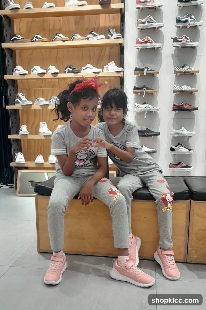Two girls posing in a shoe store