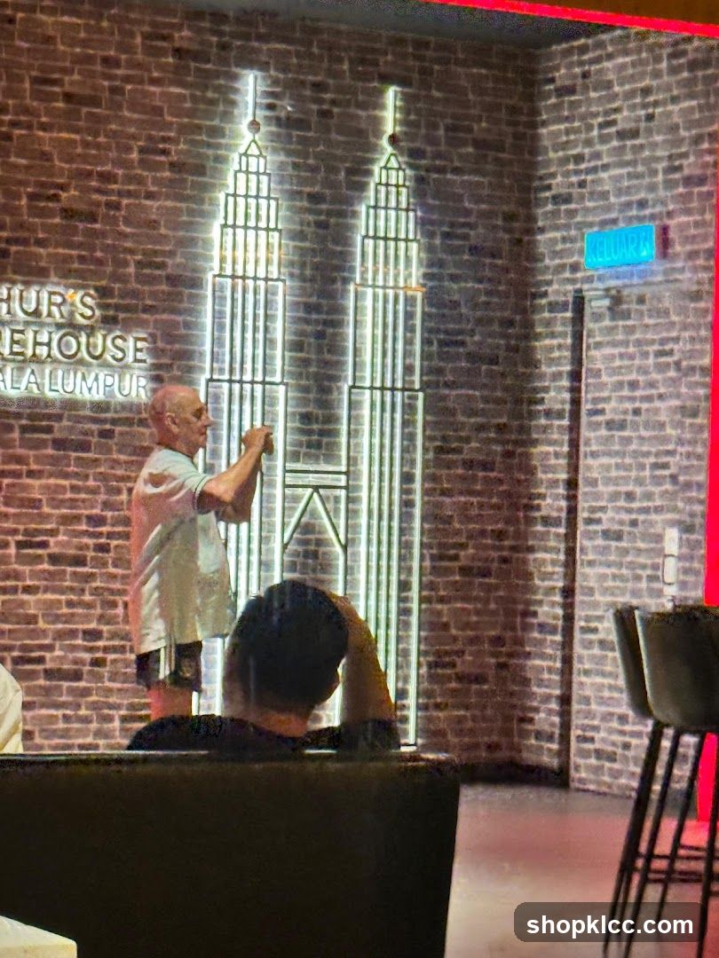 Interior of a bar with Petronas Towers neon art