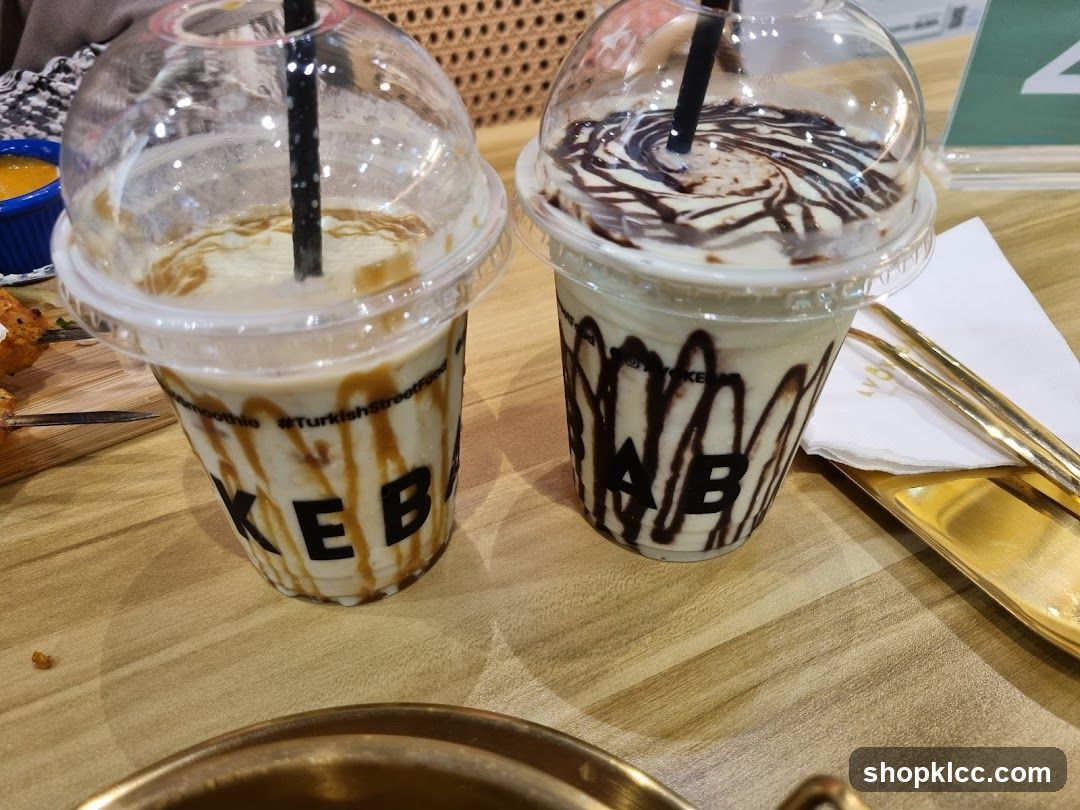Two milkshakes with toppings