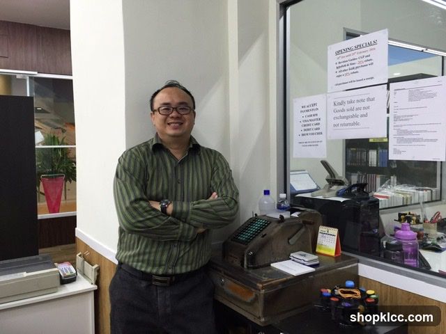 Man Posing by Counter