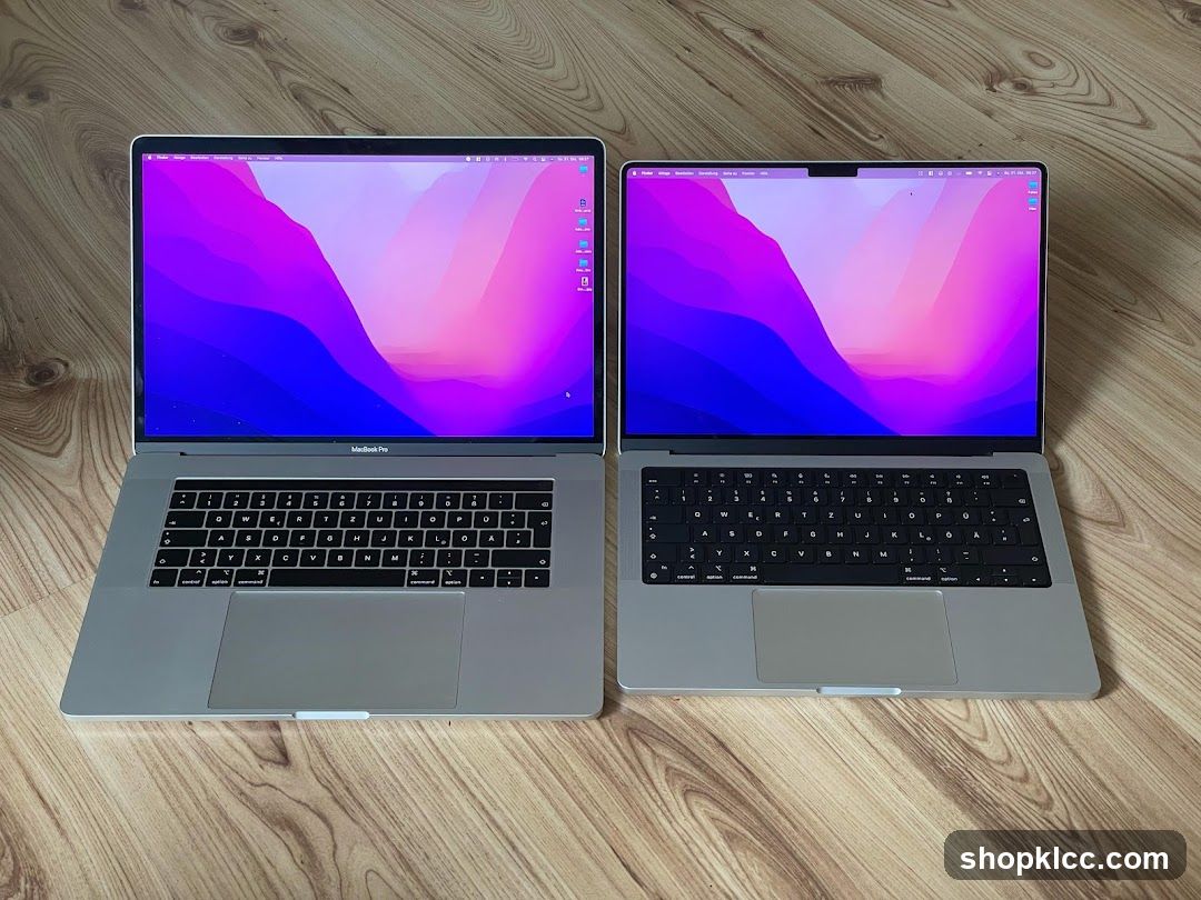 Two MacBooks on a wooden floor