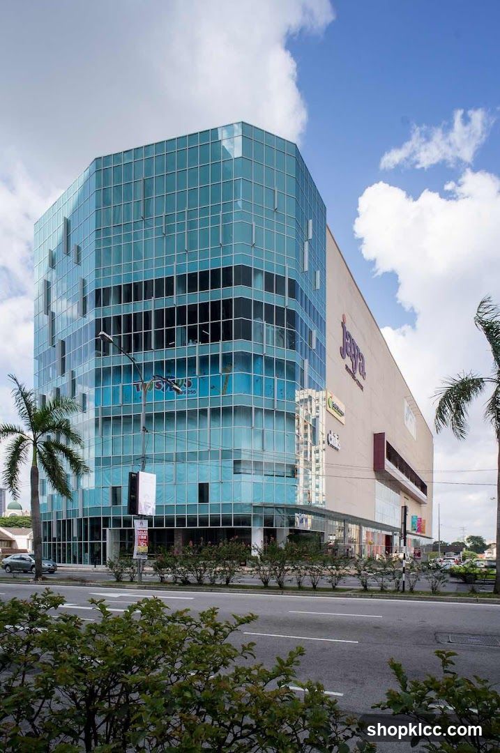 Modern Glass Building with Retail Signage