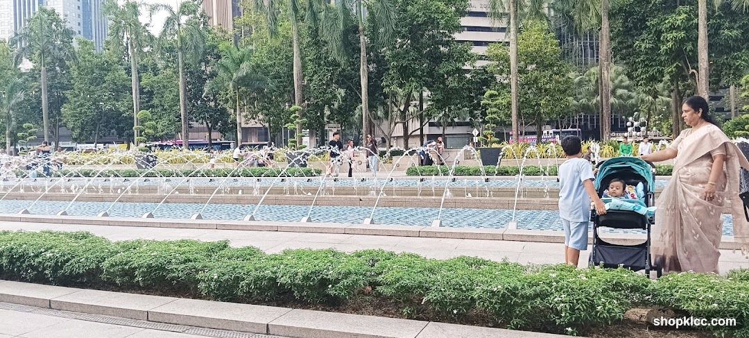 People by a Fountain