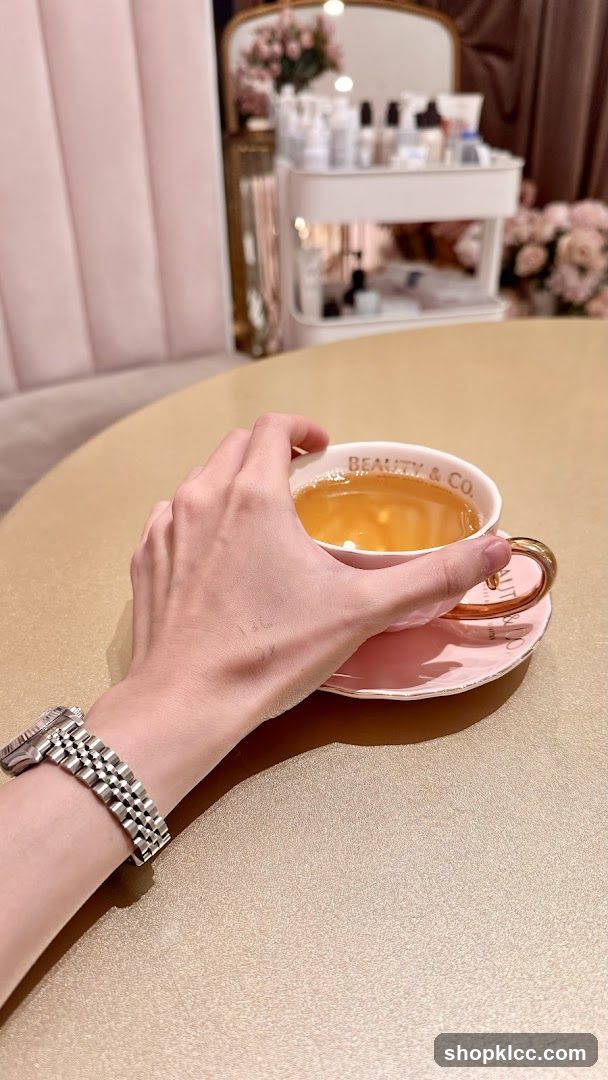 Hand holding a teacup