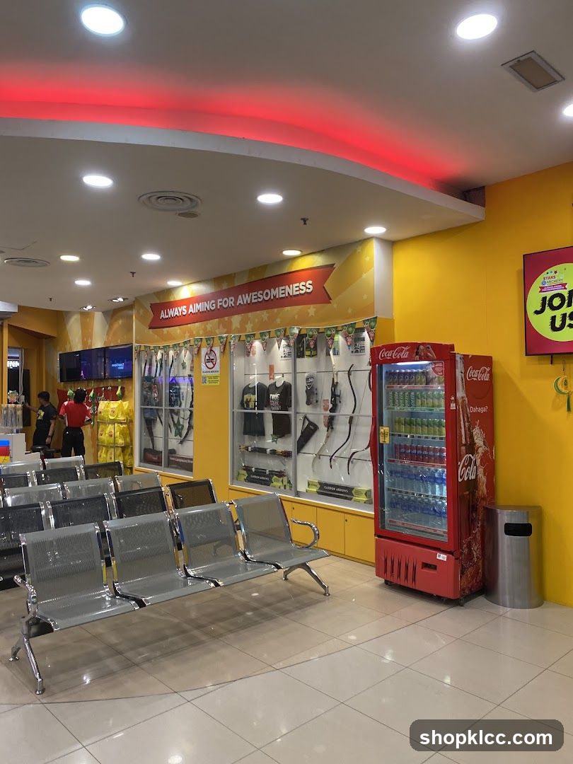 Indoor waiting area with display cases and vending machine