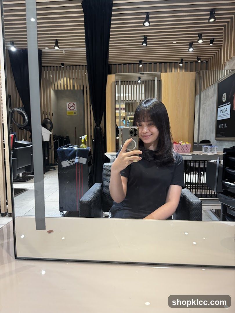 Woman taking a selfie in a salon