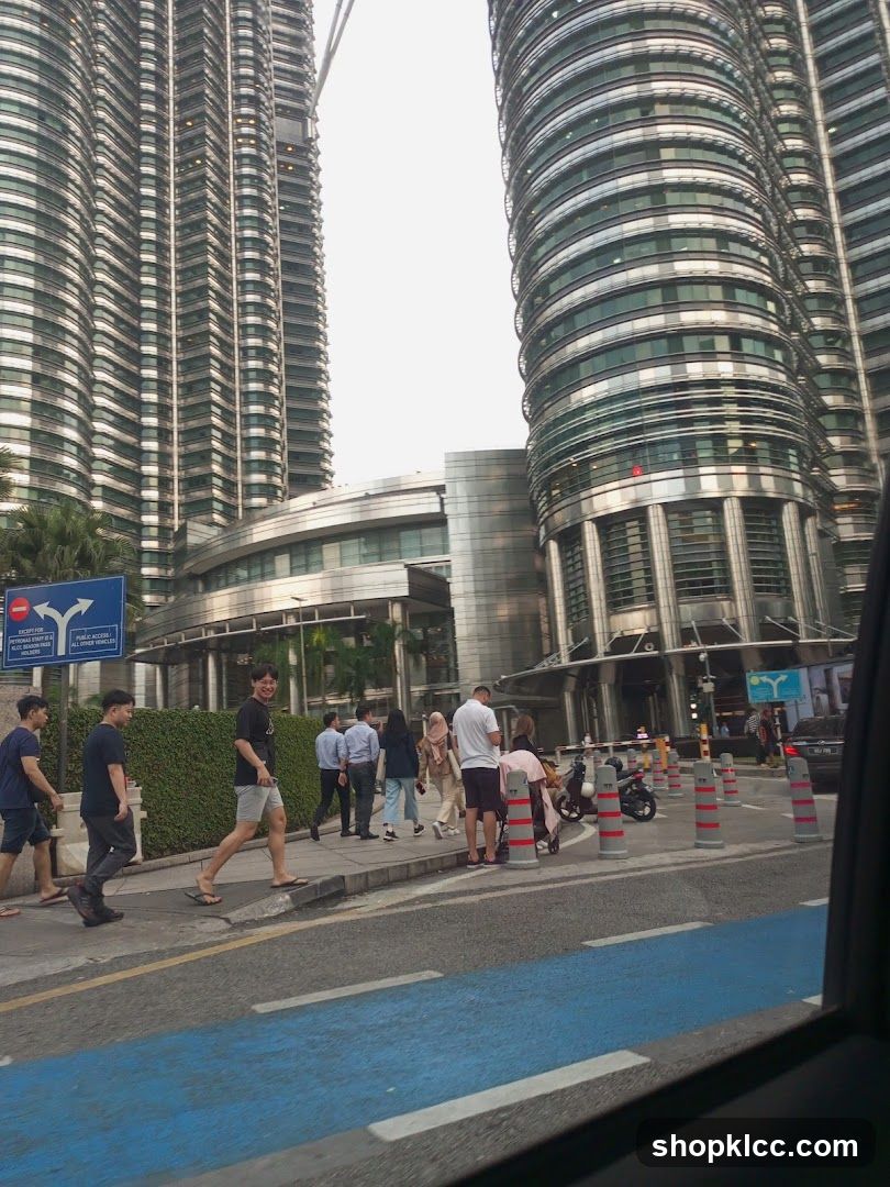 People walking near modern skyscrapers