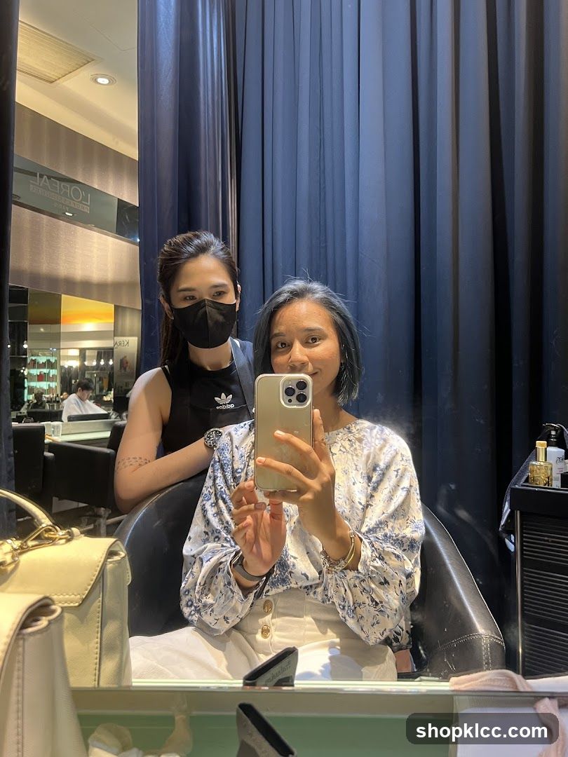 Two Women Taking a Mirror Selfie in a Salon