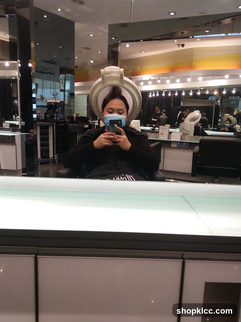 Woman using hair steamer