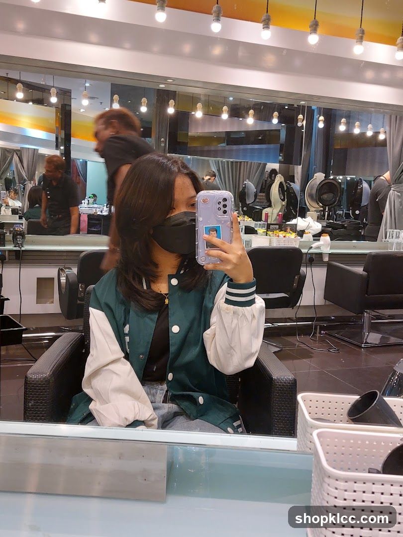 Woman taking a selfie in a salon