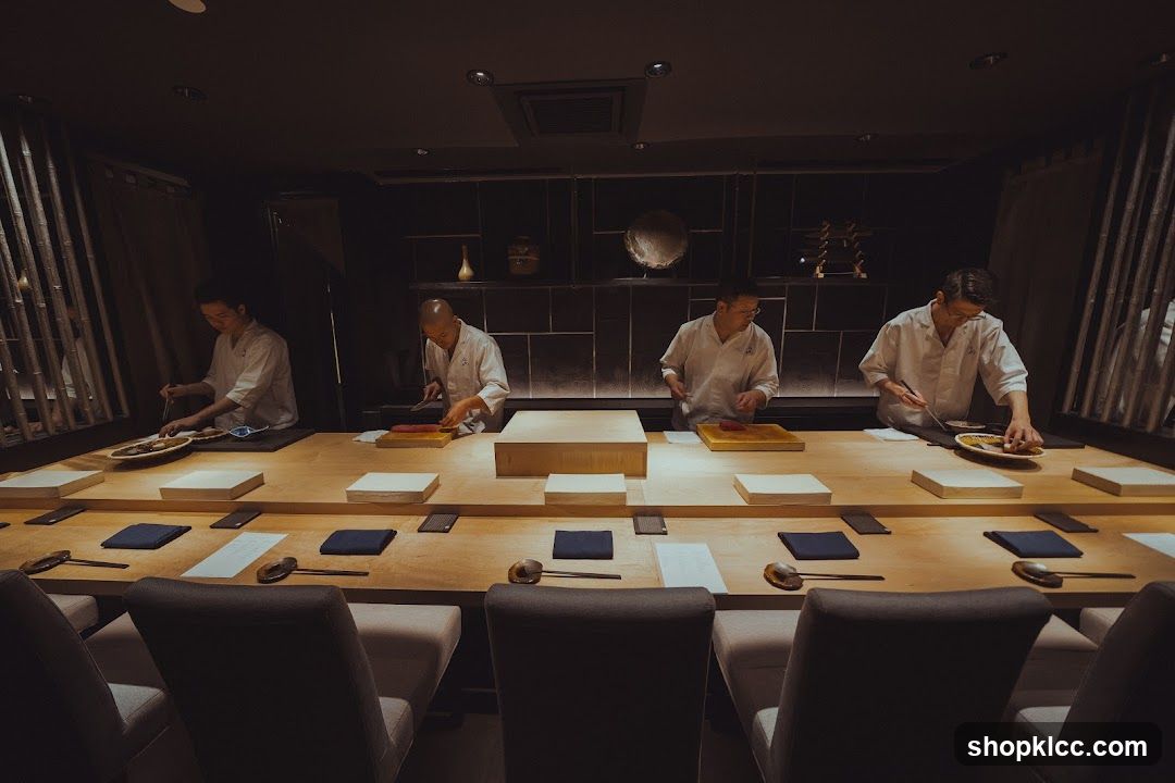 Chefs preparing food at a sushi bar