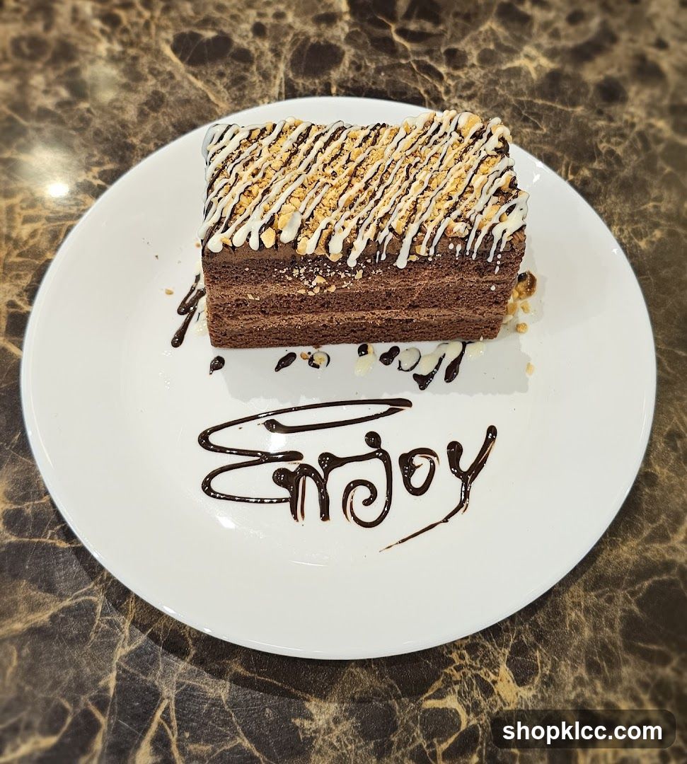 Chocolate Cake with White Drizzle and Nuts