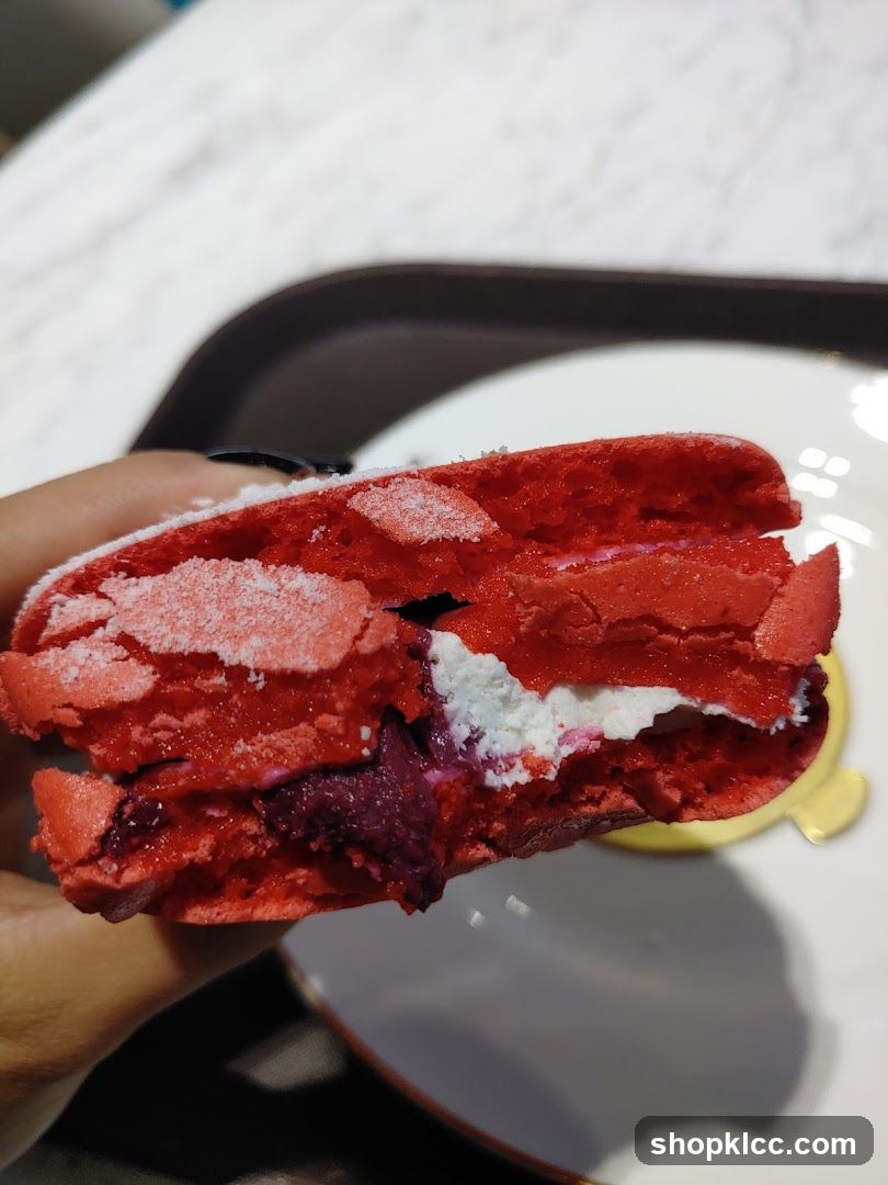 Red Macaron with Cream and Berry Filling