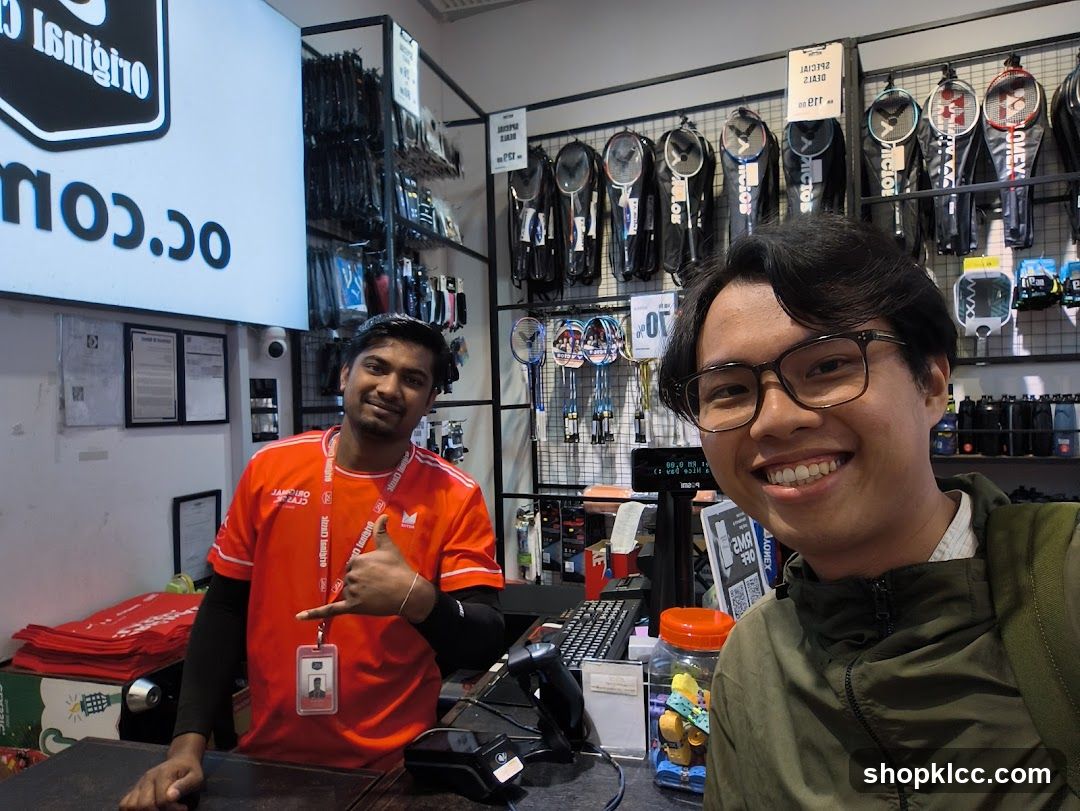 Sports store employee and customer