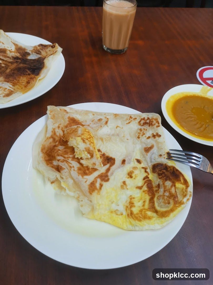 Roti Canai with Curry and Tea