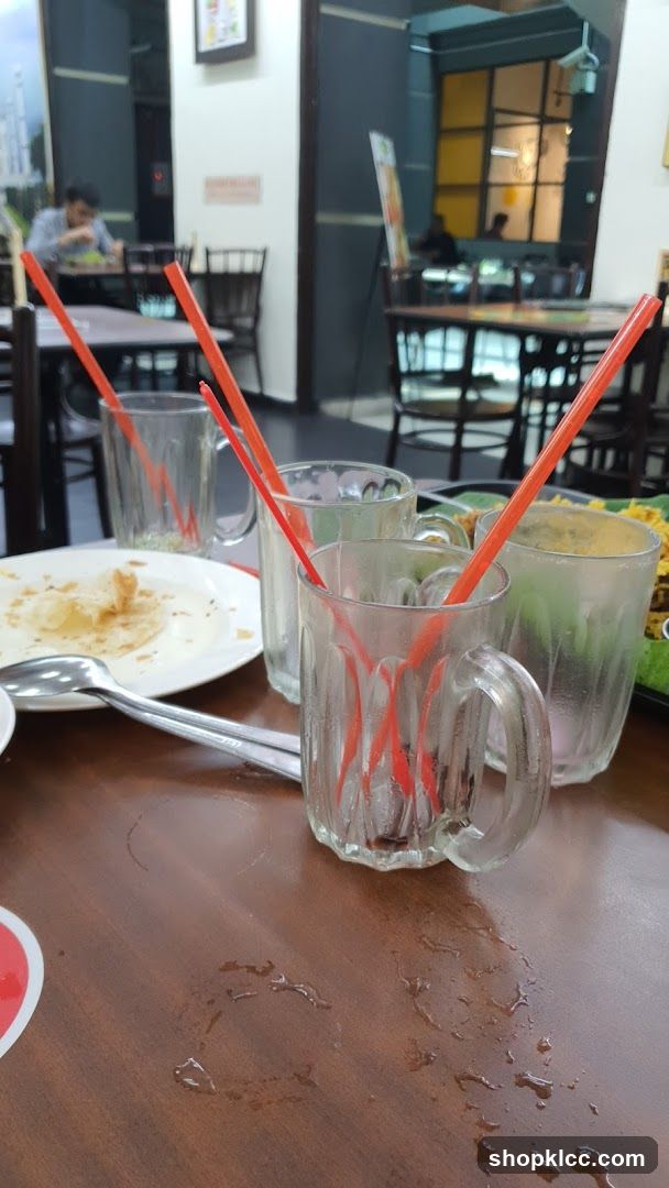 Table with used glasses and plate