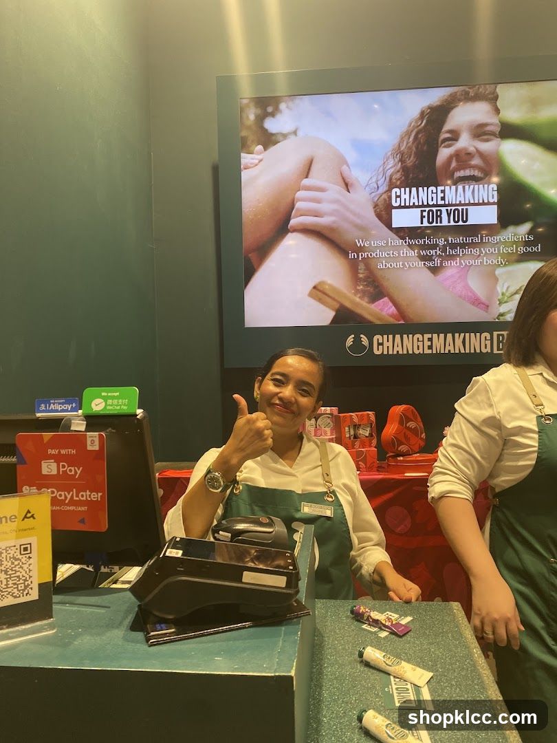 Cashier giving a thumbs up