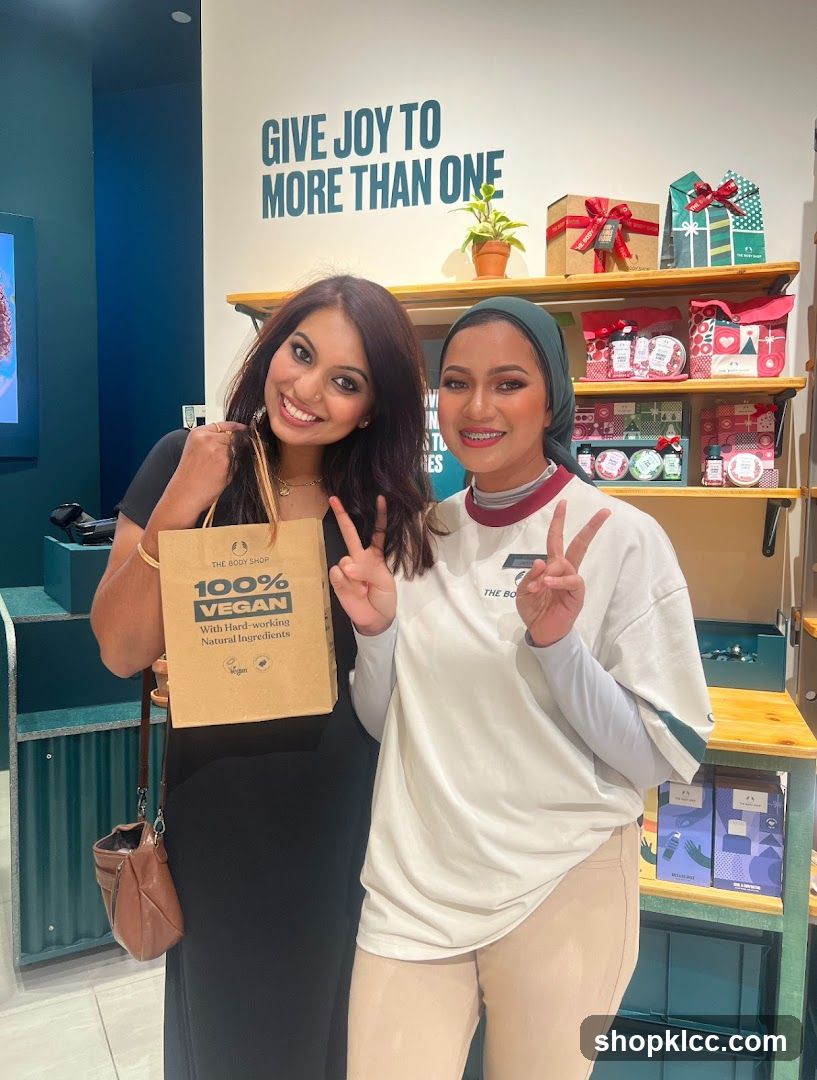 Two women posing in a store
