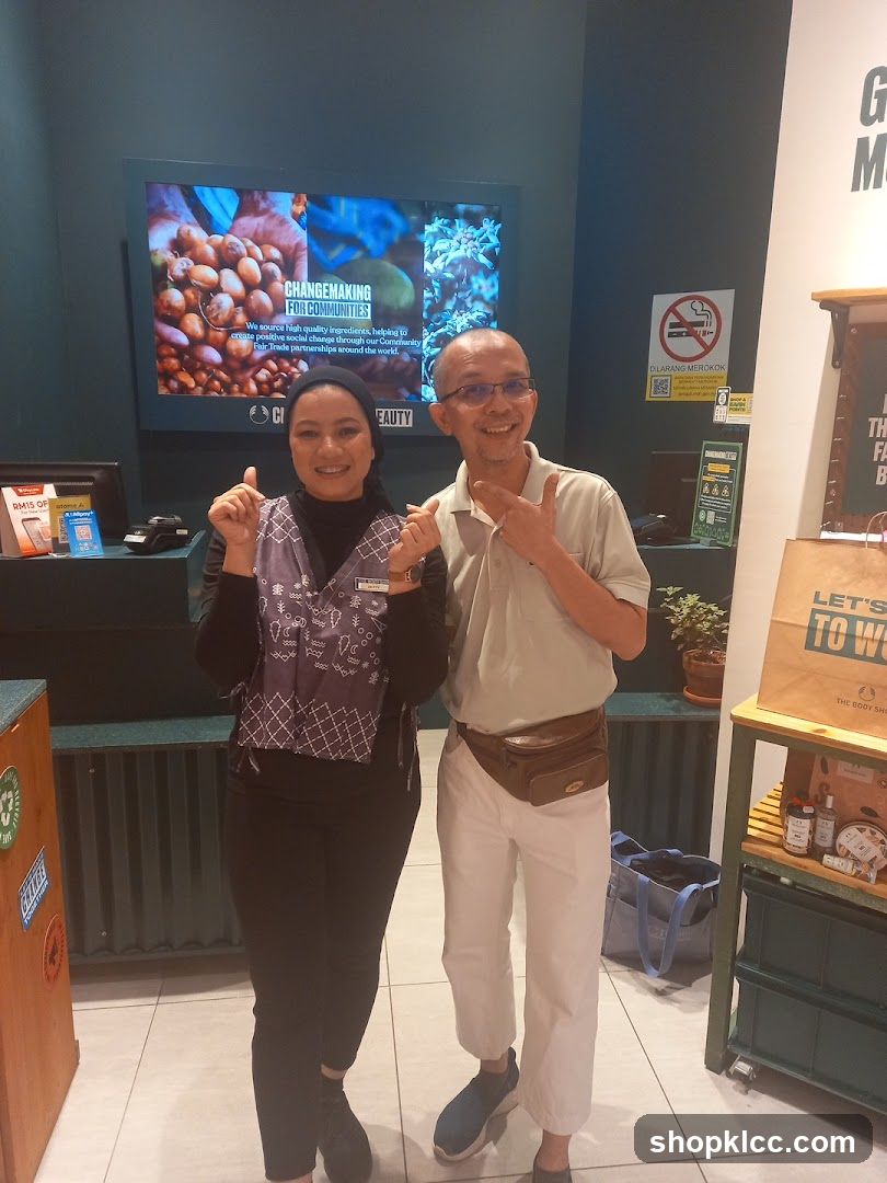 Two people posing in a store
