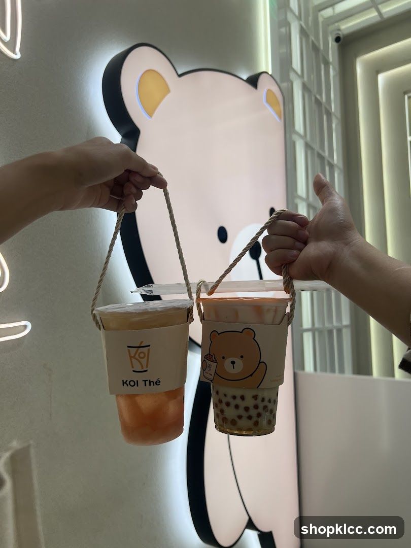 Two drinks with bear and logo