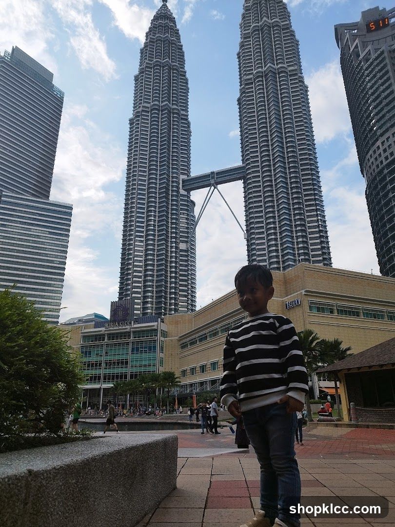 Boy in front of Petronas Towers