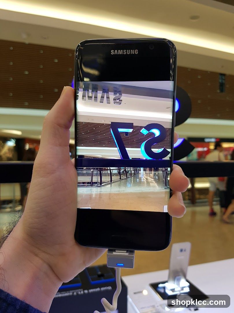 Samsung phone displaying a reflection of a store interior