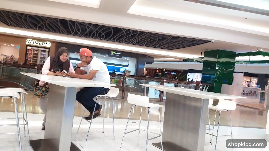 People at a table in a mall