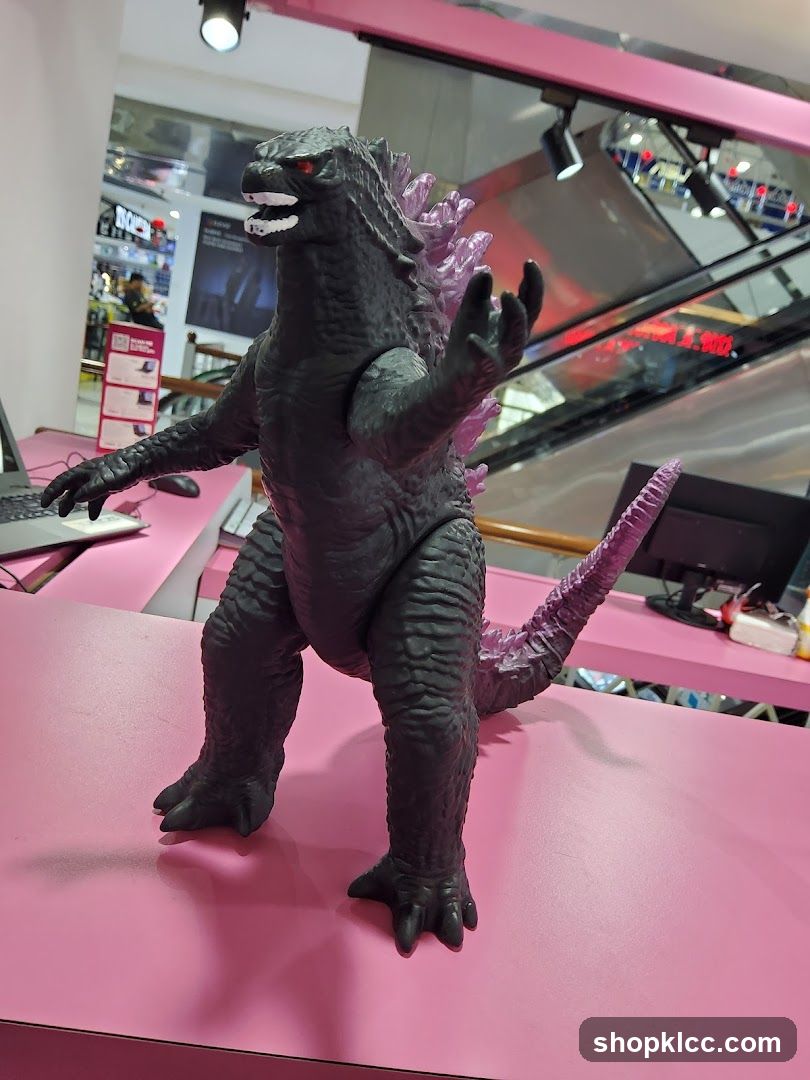 Godzilla Toy on Pink Counter